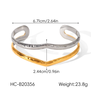 Detailed dimensions of gold and silver tone hammered wavy cuff bracelet with size specs