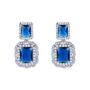 Exquisite silver-tone earrings featuring deep blue emerald-cut crystals with halo pavé setting