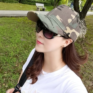 Detail of army green camouflage baseball cap featuring a six-panel crown and curved brim