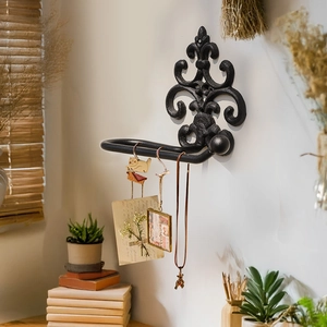 Vintage European black cast iron wall hook with ornate scroll design for towels and keys