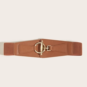 Close-up of brown elastic corset belt featuring faux leather panel and gold metal ring buckle