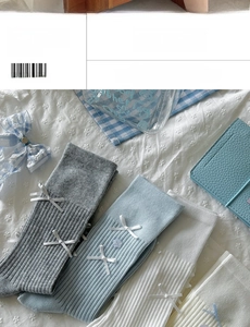 Detailed view of ballet style ribbed crew socks with ribbon bows and floral buttons