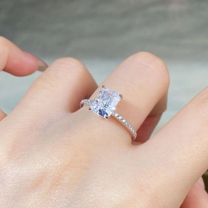 Close-up of S925 sterling silver ring featuring a radiant cut cubic zirconia on a hand