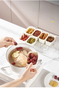 Detailed view of transparent relish box with six compartments for kitchen spices storage