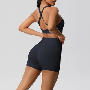 Detail of cross-back sports bra and high-waisted shorts with matte brushed fabric