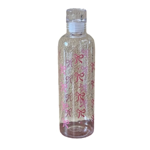 Transparent high-capacity plastic water bottle with pink bow patterns and volume markers