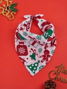 Close-up of Christmas pet bandana with festive gingerbread and tree patterns