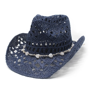 Detail of dark blue hollow-out straw cowboy hat with heart-beaded decorative band