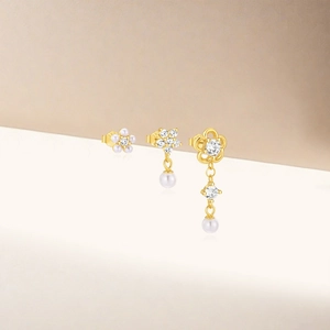 Detailed close-up of S925 silver petal earrings set with pearls and zirconia