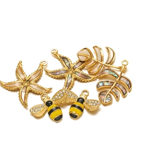 Golden starfish and bee charms with abalone shell inlays for DIY jewelry making