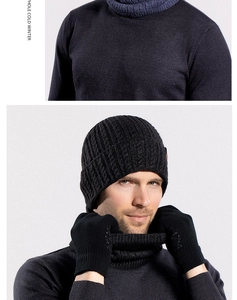 Close-up of black cable-knit beanie with matching ribbed neck gaiter and gloves set