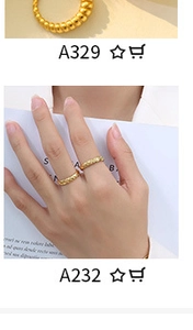 Detail view of 18K gold plated textured rings and twisted ring designs on model