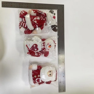 Three Christmas curtain buckles with Santa, snowman, and reindeer figures shown with ruler