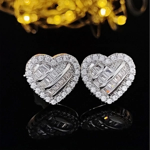 Sparkling silver heart stud earrings with pave-set cubic zirconia on a black mirror base