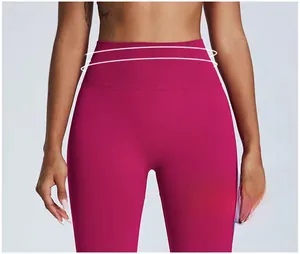 Detailed close-up of high-waist fitness leggings in rose red showing abdominal support fabric