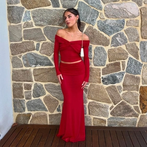 Macro detail of red off-shoulder long sleeve top and high waist maxi skirt set