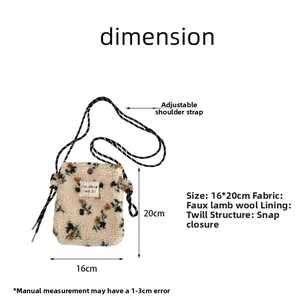Detail view of floral plush shoulder bag with snap closure and adjustable strap