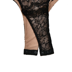 Detail of lace bodysuit with metal snap button closure and two-tone fabric lining