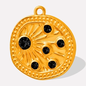 Detailed shot of 18k gold plated 304 stainless steel relief pendant with black gemstones