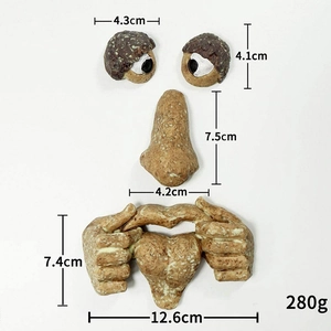 Detailed view of four-piece resin tree face decor with glowing eyes and bark texture