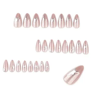 Cat eye almond press-on nails in champagne pink with 3D silver star patterns