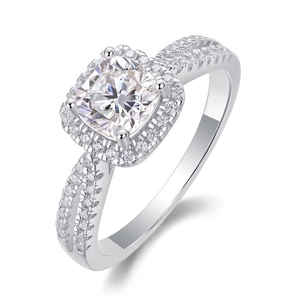 Close-up of square moissanite ring with four-prong setting and pavé double band