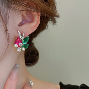 Detail shot of multicolor teardrop crystal earrings with pink and green stones