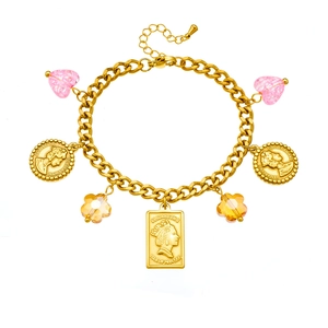 Chunky gold charm bracelet featuring pink heart crystals and vintage Elizabeth II coins