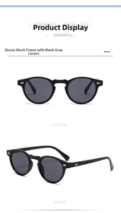 Détail de lunettes de soleil rondes noires rétro avec clous dorés et verres gris