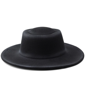 Detailed view of the stitched brim and texture of this black wool felt flat top fedora