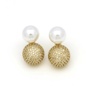 Detail shot of vintage pearl earrings with gold-toned pavé rhinestone studded spheres