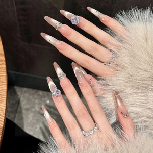 Cat eye stiletto press-on nails with heart rhinestones and pink glitter shimmer
