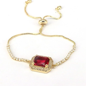 Luxurious gold adjustable box chain bracelet with rectangular red stone and zircon halo