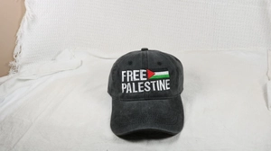 Detail shot of Free Palestine embroidery on vintage black washed baseball cap