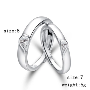 Detail of S925 silver couple rings showing the S925 hallmark and heart-shaped gemstone setting