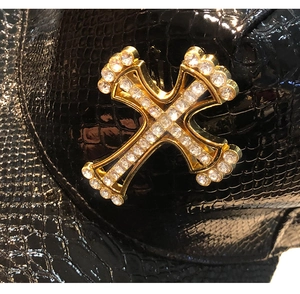 Detail of laser PU leather baseball cap with golden rhinestone cross and crocodile texture