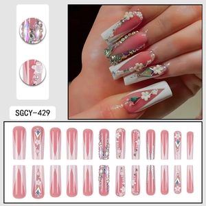 White French press-on nails with 3D flowers, pearls and rhinestones on soft pink base