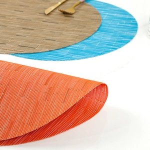 Round PVC placemats with bamboo weave texture in brown, blue and orange colors
