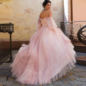 Pink off-shoulder tulle ball gown with puff sleeves and lace embroidery accents