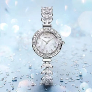 Luxury women's quartz watch with rhinestone shells and silver metal strap on pearl background