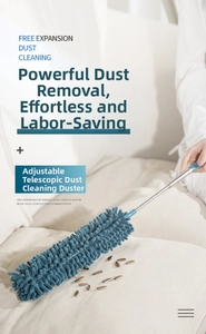 Close-up of extendable blue chenille duster cleaning debris on a fabric sofa surface