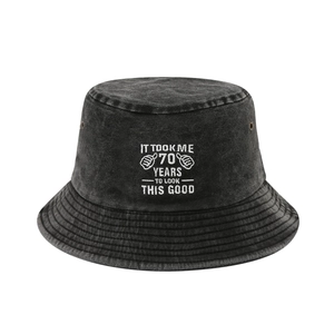 Washed black cotton bucket hat with white 70th birthday embroidery and retro design