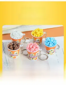 Miniature popcorn bucket keychain in five vibrant colors with realistic kernel textures