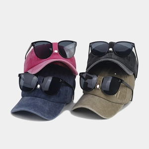 Detail of vintage pilot baseball caps with goggles in four colors and VV embroidery