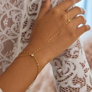 Elegant 18k gold plated slave bracelet with zircon stones on model with lace clothing