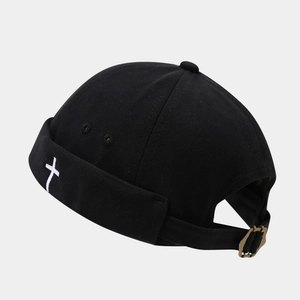 Black docker cap with white cross embroidery and adjustable bronze metal buckle