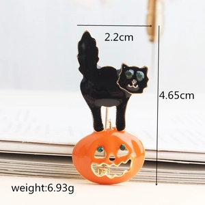 Halloween black cat on pumpkin brooch with green rhinestones and 4.65cm height dimensions