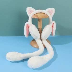 Detailed view of white plush earmuffs with sequined cat ears and moving airbag pump