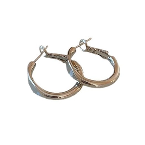 Elegant gold twisted hoop earrings with a polished finish and minimalist aesthetic design