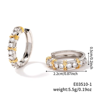 Detail view of silver hoop earrings with gold accents and cubic zirconia, 2.2cm diameter
